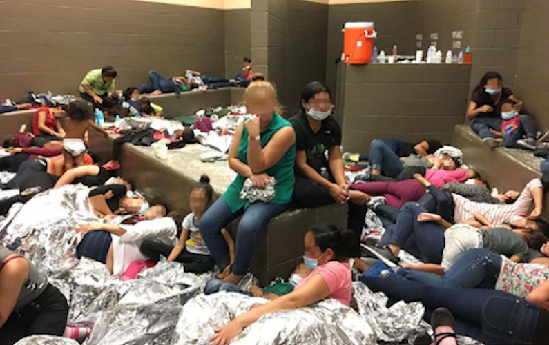 Children and adults are detained a detention center in the Rio Grande.